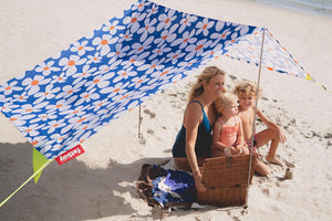 Mom and Children Sitting Under a Malibu Fatboy Miasun Sun Shade on the Beach