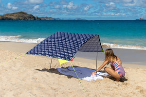 Girl Under a Mochi Fatboy Miasun Sun Shade Setup on the Beach