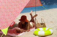 Load image into Gallery viewer, Girl Reading a Book Under a Palm Beach Fatboy Miasun Sun Shade on the Beach
