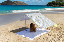 Load image into Gallery viewer, Girl Laying Under a Sicily Fatboy Miasun Sun Shade on the Beach
