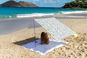 Girl Laying Under a Sicily Fatboy Miasun Sun Shade on the Beach