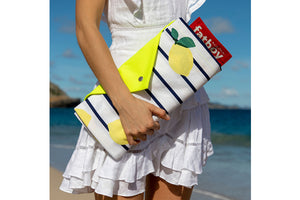 Girl Carrying a Folded Sicily Fatboy Miasun Sun Shade on the Beach