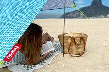 Load image into Gallery viewer, Girl Reading a Book Under a Venice Fatboy Miasun Sun Shade on the Beach

