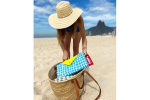 Girl Taking a Folded Venice Fatboy Miasun Sun Shade Out of Her Beach Bag