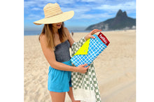 Load image into Gallery viewer, Girl Carrying a Folded Venice Fatboy Miasun Sun Shade on the Beach
