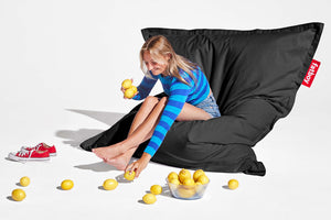 Girl Sitting on a Black Fatboy Original Stonewashed Bean Bag