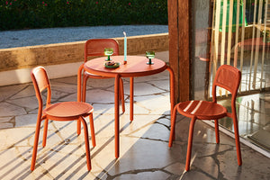 Tangerine Fatboy Toni Chairs on a Patio