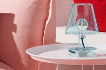 Load image into Gallery viewer, Blue Fatboy Transloetje Lamp Sitting on a Plat-o Table
