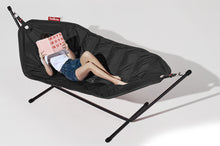 Load image into Gallery viewer, Model Laying on a Black Fatboy Headdemock Deluxe Hammock Reading a Book
