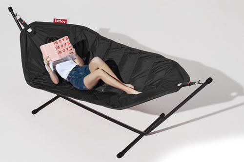 Model Laying on a Black Fatboy Headdemock Deluxe Hammock Reading a Book