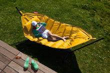 Load image into Gallery viewer, Model Laying on a Daisy Yellow Fatboy Headdemock Deluxe Hammock Reading a Book
