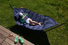 Load image into Gallery viewer, Model Laying on a Dark Blue Fatboy Headdemock Deluxe Hammock Reading a Book
