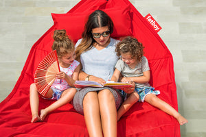 Mom and Kids Laying on a Red Fatboy Headdemock Deluxe Hammock Reading a Book