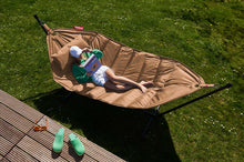 Load image into Gallery viewer, Model Laying on a Sesame Fatboy Headdemock Hammock Reading a Book
