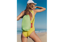 Load image into Gallery viewer, Girl Carrying a Green Fatboy Lamzac O in a Carrying Case
