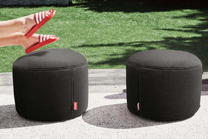 Two Thunder Grey Fatboy Point Outdoor Ottomans on a Patio