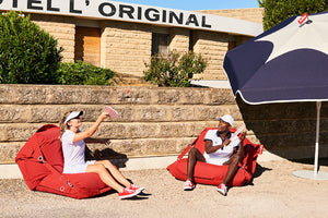 Models Sitting on Red Buggle-Up Outdoors