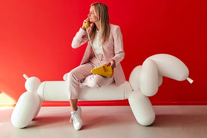 Model Sitting on a White Fatboy Attackle Talking on the Phone