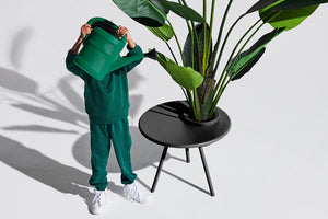Boy Watering a Plant in a Fatboy Bakkes Side Table