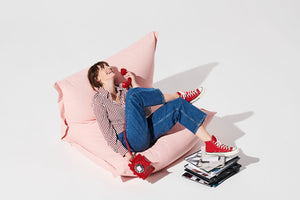 Model Sitting on a Blossom Fatboy BonBaron Chair Talking on the Phone