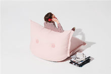Load image into Gallery viewer, Back Side of a Model Sitting on a Blossom BonBaron Chair Talking on the Phone

