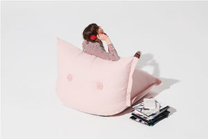 Back Side of a Model Sitting on a Blossom BonBaron Chair Talking on the Phone