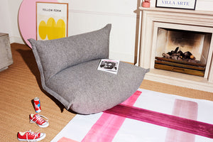 Grid Stone Fatboy BonBaron Mingle Chair in a Living Room Next to a Fireplace