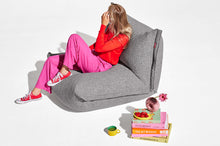 Load image into Gallery viewer, Model Sitting on a Grid Stone Fatboy BonBaron Mingle Chair
