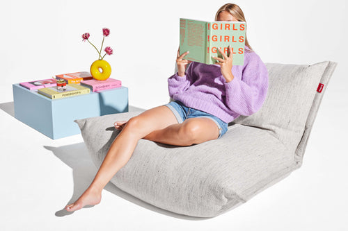 Model Sitting on a Marble Fatboy BonBaron Mingle Reading a Book