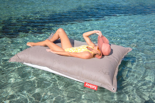 Model Floating on a Grey Taupe Fatboy Floatzac