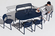 Load image into Gallery viewer, Models Sitting at Dark Ocean Fatboy Toni Tavolo Outdoor Dining Table and Chairs
