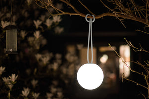 Light Grey Fatboy Bolleke Lamp on a Tree Branch at Night