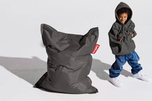 Load image into Gallery viewer, Boy Standing Next to a Dark Grey Fatboy Junior Bean Bag Chair
