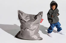 Load image into Gallery viewer, Boy Standing Next to a Silver Fatboy Junior Bean Bag Chair
