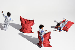 Boy with Red Fatboy Junior Stonewashed Bean Bag Chairs