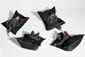Girl Sitting on a Black Fatboy Original Bean Bag in Different Positions