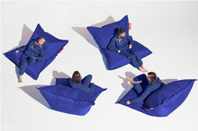 Load image into Gallery viewer, Girl Sitting on a Petrol Fatboy Original Bean Bag in Different Positions
