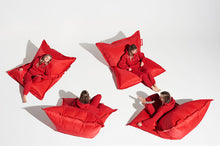 Load image into Gallery viewer, Girl Sitting on a Red Fatboy Original Slim Nylon Bean Bag in Different Positions
