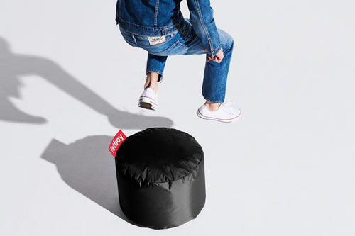 Model with a Black Fatboy Point Ottoman