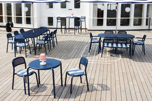Dark Ocean Fatboy Toni Tables and Chairs on a Boat Deck